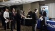 Job seekers line up at a job fair in Boston. While overall unemployment for Asian-Americans remains below the national average, their rate of long-term unemployment is the highest. 