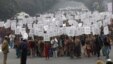 Women hold placards as they march during a rally organized by Delhi Chief Minister Sheila Dikshit (unseen) protesting for justice and security for women, in New Delhi, January 2, 2013.