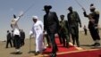 South Sudanese President Salva Kiir, center, walks with Sudanese counterpart Omar al-Bashir, Khartoum, Oct. 2011 (file photo).