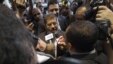 Mohamed Morsi, the Muslim Brotherhood's presidential candidate, is surrounded by reporters in Cairo, Egypt, May 26, 2012.