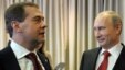 Russian President Vladimir Putin, right, and Prime Minister Dmitry Medvedev attend the United Russia party annual congress in Moscow, May 26, 2012.