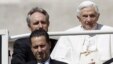 The Pope's butler, Paolo Gabriele (bottom L) arrives with Pope Benedict XVI (R) at St. Peter's Square in Vatican, in this file photo taken May 23, 2012.