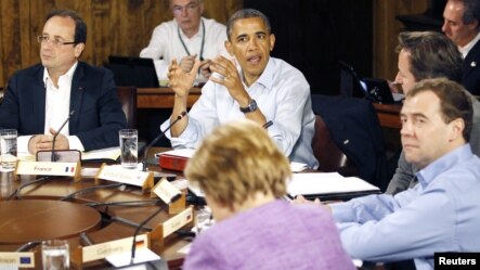 Clockwise from top: French President Francois Hollande, U.S. President Barack Obama, Britain's Prime Minister David Cameron, Russia's Prime Minister Dmitri Medvedev and Germany's Chancellor Angela Merkel (back to camera) at the G-8 Summit at Camp David, n
