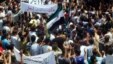 A handout image released by the Syrian opposition's Shaam News Network shows anti-regime demonstrators during a protest in Homs province, May 25 , 2012.