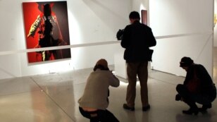 The controversial portrait of South African President Jacob Zuma painted by Brett Murray stands defaced  at the Goodman Gallery in Johannesburg, South Africa.