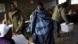 A Lesotho man wearing a traditional blanket prepares to vote at the Mpho primary school in Maseru, Lesotho,  May 26, 2012.